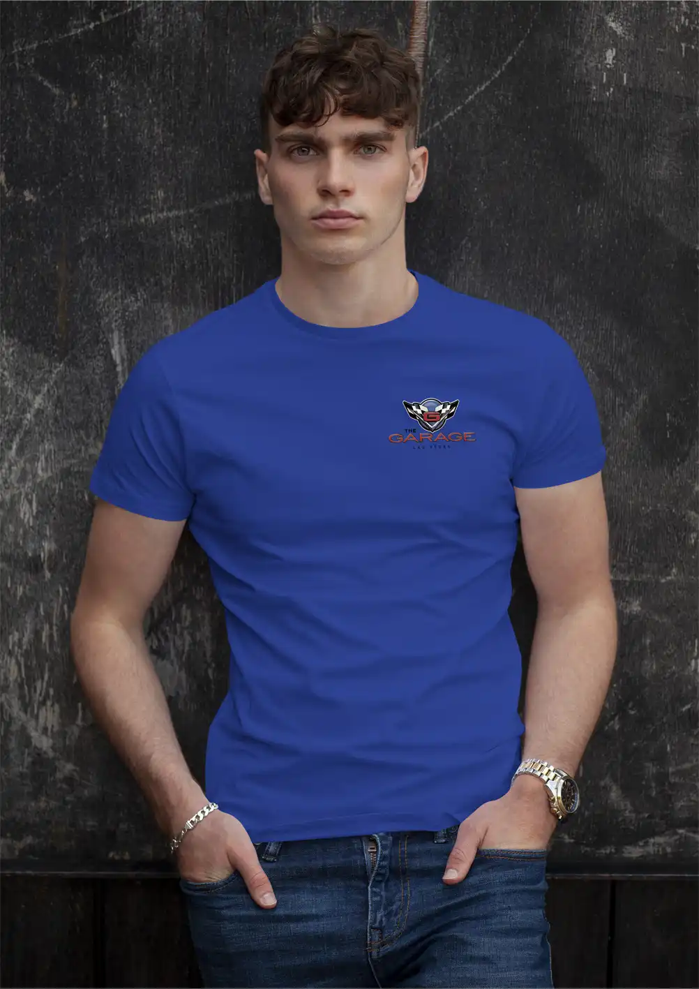 Handsome guy modeling a blue T-shirt with The Garage Las Vegas logo